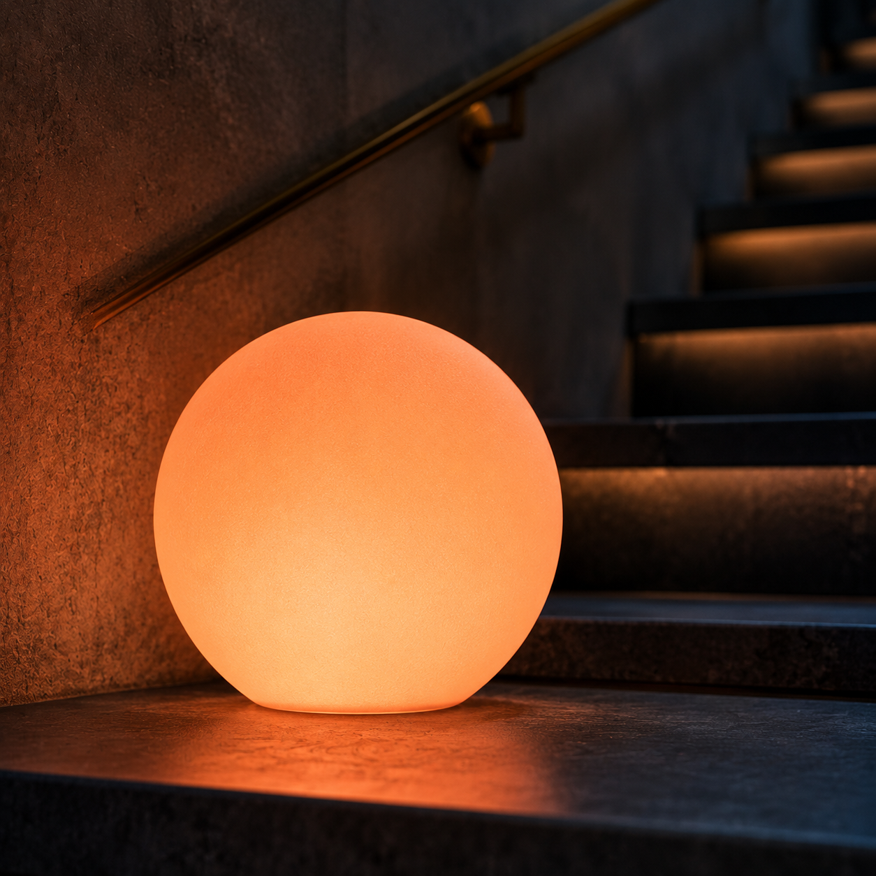 An amber glow orb illuminating a dark staircase